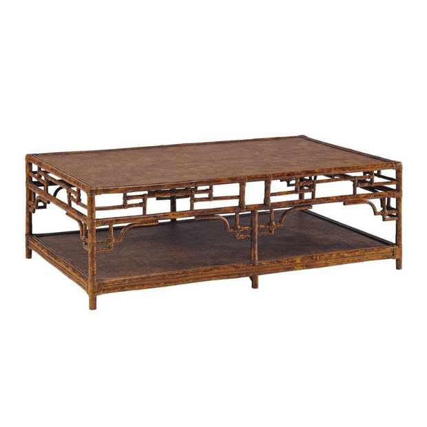 A brown wooden coffee table with a woven top and shelf.